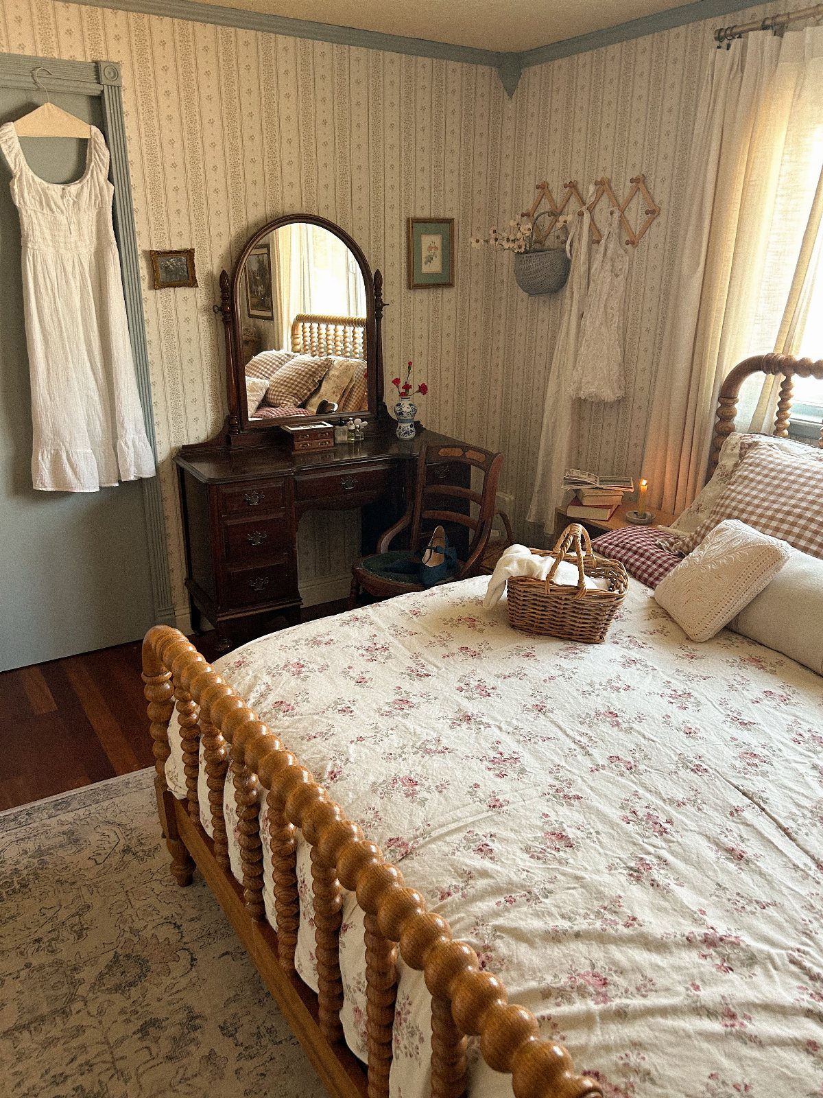 12 Small Bedroom Mirror Ideas That Make a Room Feel Bigger 11 Rustic bedroom with a wooden bed and a vintage vanity with arched mirror.