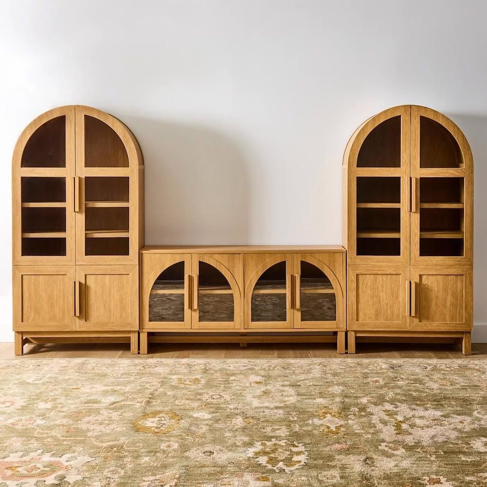 Oak TV Unit Ideas: 17 Styles from Floating to Built-in 12 Arched oak entertainment center with glass doors and tall side cabinets on a rug.