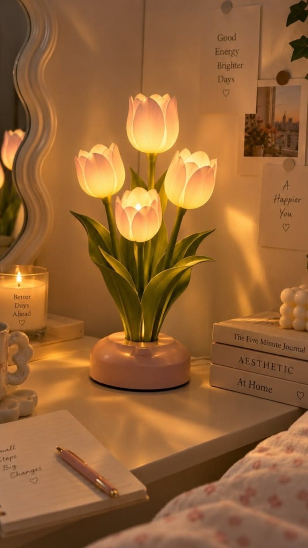 40 Home Decor Item Ideas, From Candle Holders to Sculptures 16 Tulip-shaped bedside lamp with four glowing flower heads on a white nightstand.