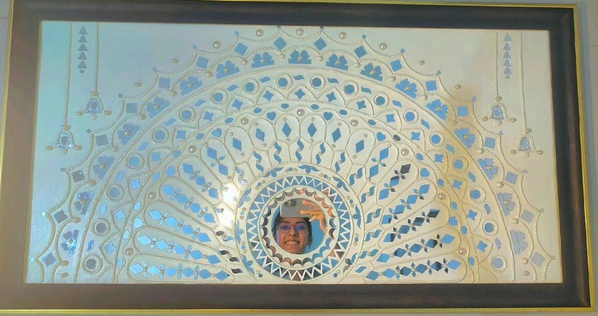 Mirror Wall Art: 25 Ideas from Sunburst to Floor Mirrors 25 Rectangular framed wall art with a semi-circular mosaic of small blue mirror pieces.