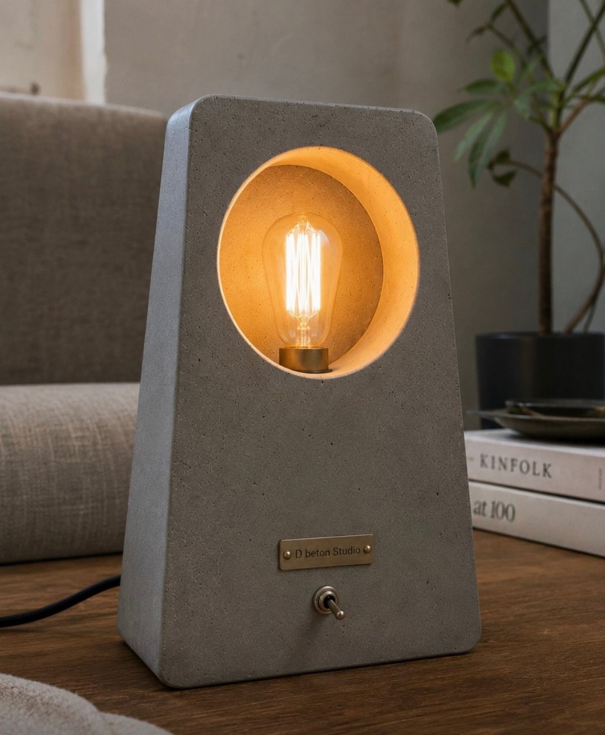 17 Handmade Lamps Ideas Using Wood, Concrete, and Glass Jars 4 Grey concrete table lamp with a circular opening and glowing Edison bulb.