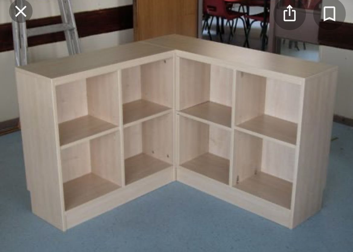 24 Corner Shelves IKEA Ideas for Kitchens, TVs and Plants 13 L-shaped light wood cube storage shelving unit with open compartments on blue flooring.