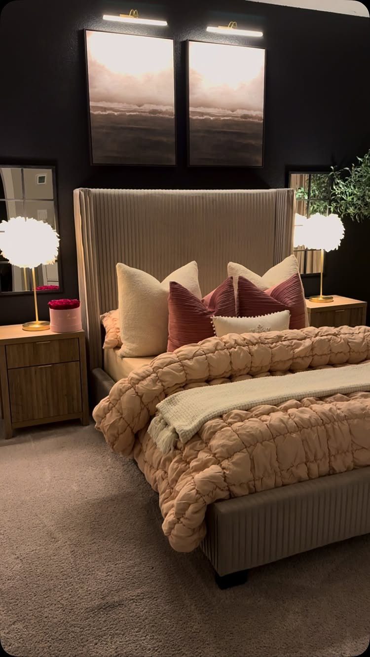13 Alt Room Decor Ideas with Moody Colors, Wood, and Plants 2 Bed with cream quilted bedding and burgundy pillows against charcoal grey walls.