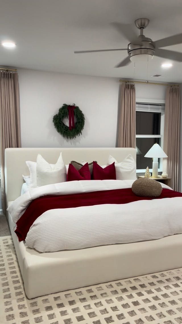 13 Alt Room Decor Ideas with Moody Colors, Wood, and Plants 8 White bed with cream duvet and burgundy throw blanket in a bright room.