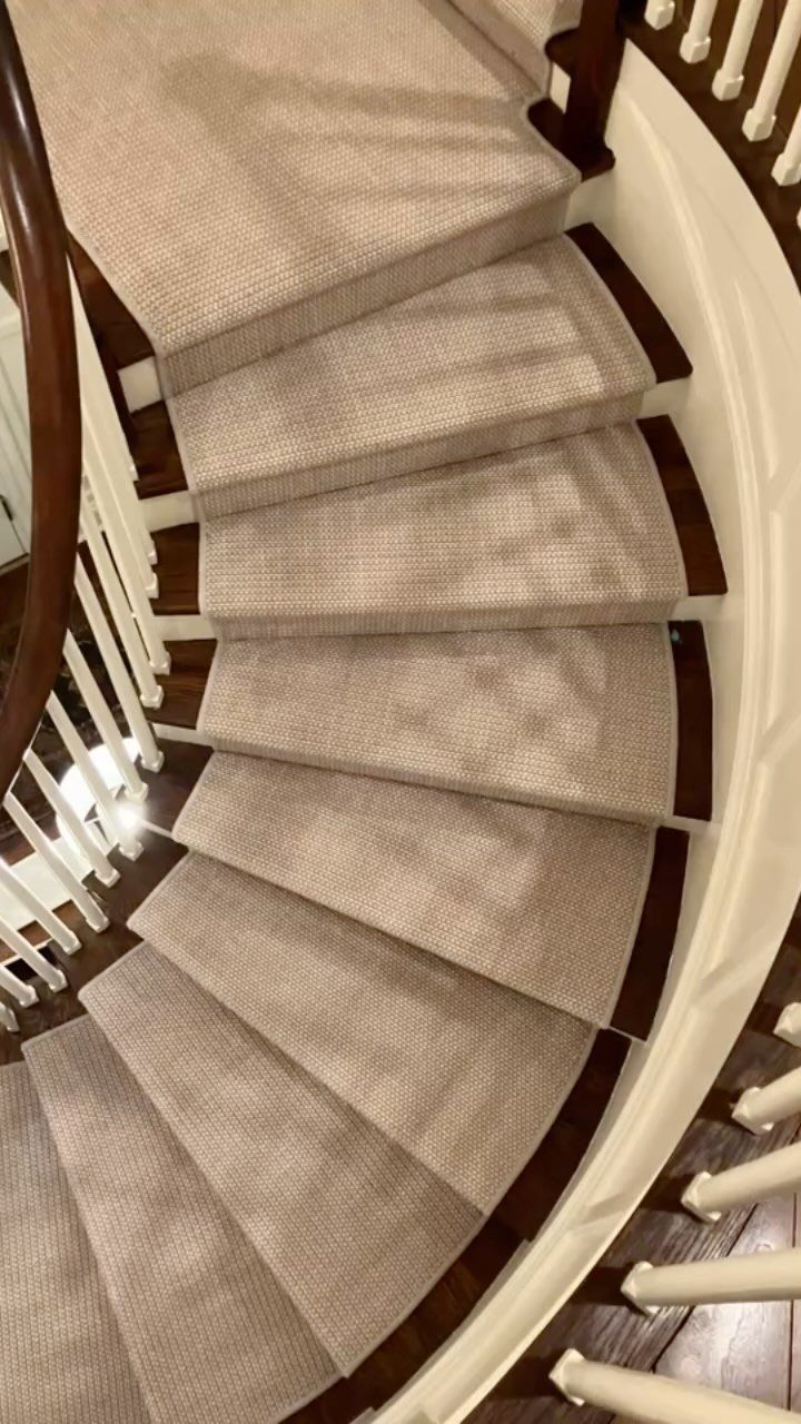 Stairs with Carpet: 23 Styles from Runners to Bold Patterns 16 Curved staircase with beige textured carpet and white banisters with dark wood handrail