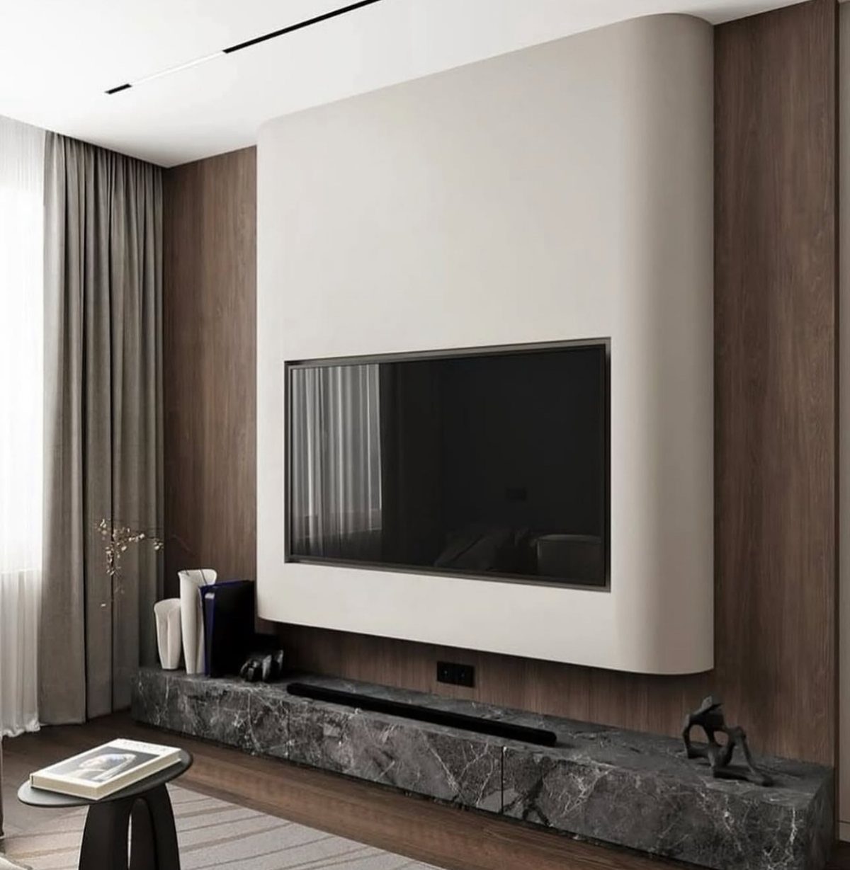 Curved off-white TV wall panel with a dark marble floating console and wood accents.