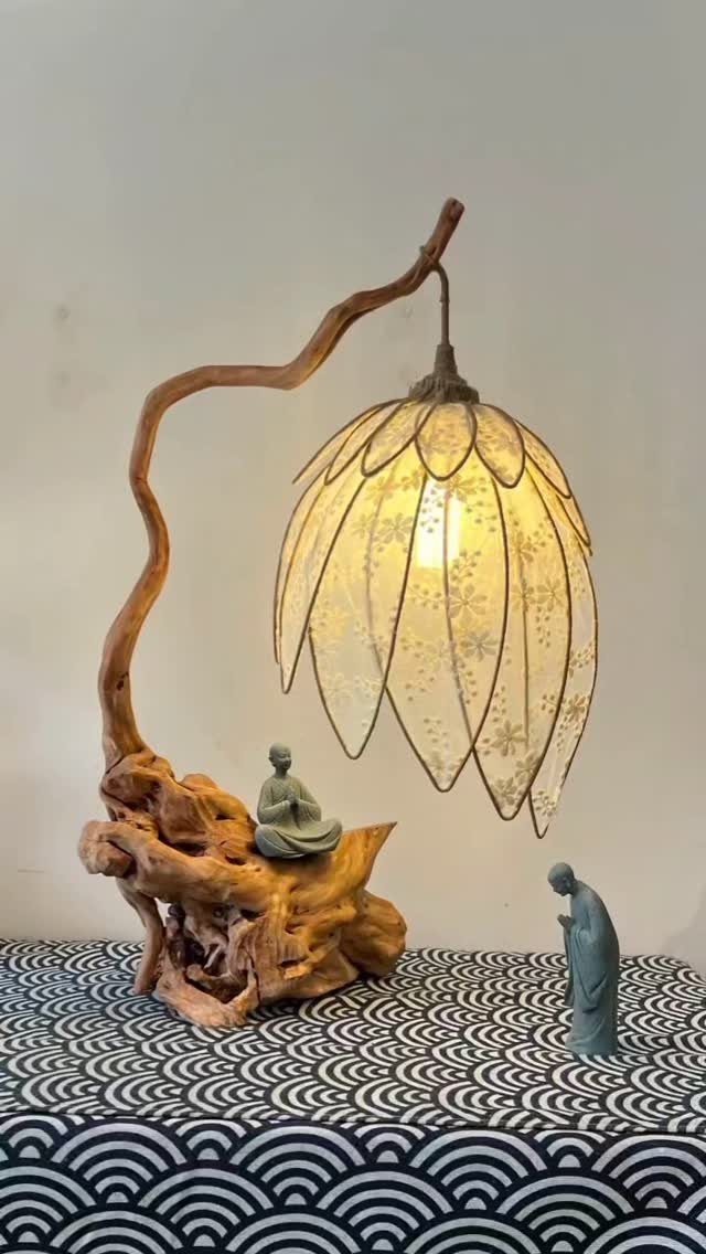 Make Table Lamp Ideas: 14 Designs in Wood, Glass and Ceramic 11 Lotus-shaped table lamp with a driftwood branch stand and small meditating figurines.