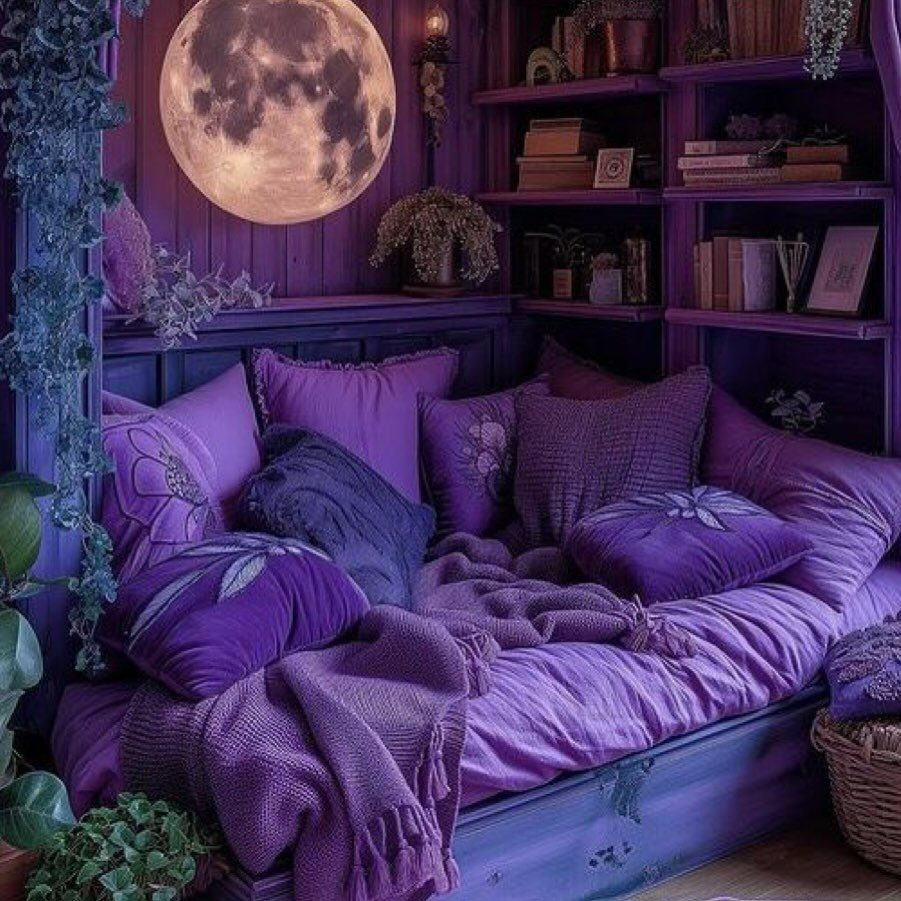 Purple reading nook with a daybed, plush cushions, bookshelves, and a moon lamp.