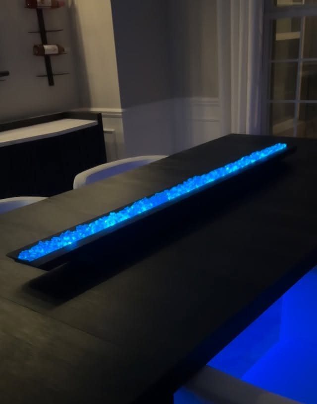Make Table Lamp Ideas: 14 Designs in Wood, Glass and Ceramic 10 Long black rectangular table lamp with glowing blue decorative stones inside.