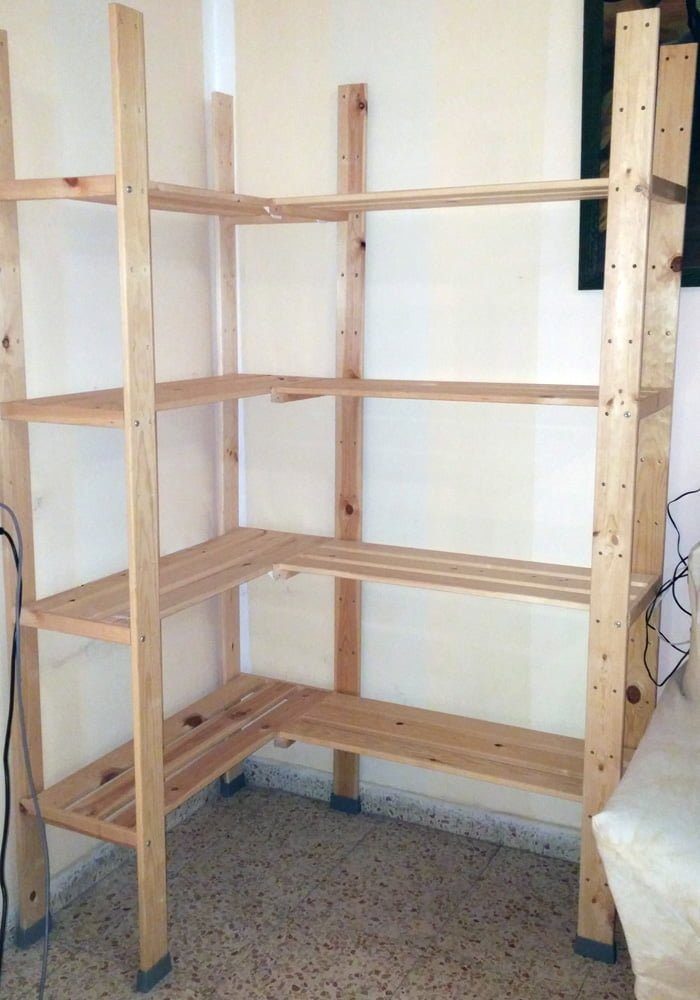 24 Corner Shelves IKEA Ideas for Kitchens, TVs and Plants 6 Natural wood corner shelving unit with four slatted tiers against a white wall.