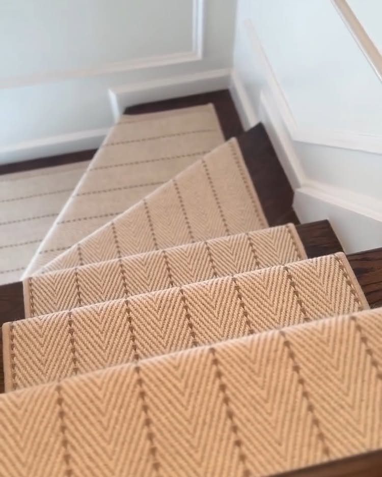 Stairs with Carpet: 23 Styles from Runners to Bold Patterns 10 Beige and brown herringbone patterned carpet runner on dark wood stairs with white walls.