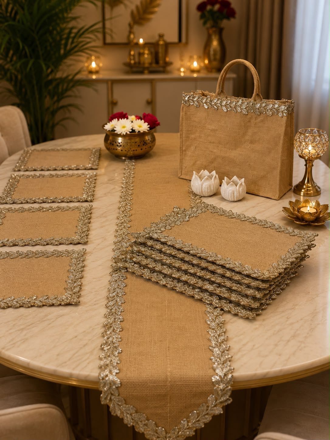 Jute table runner with gold sequin trim on a white marble dining table.
