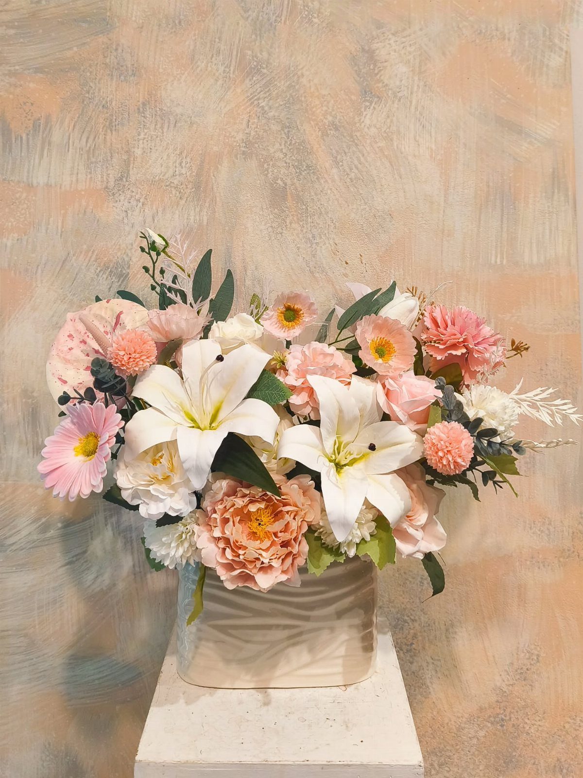 12 Artificial Flowers Decor Ideas, from Vases to Gift Boxes 8 Artificial flower arrangement with white lilies and pink peonies in a white vase.