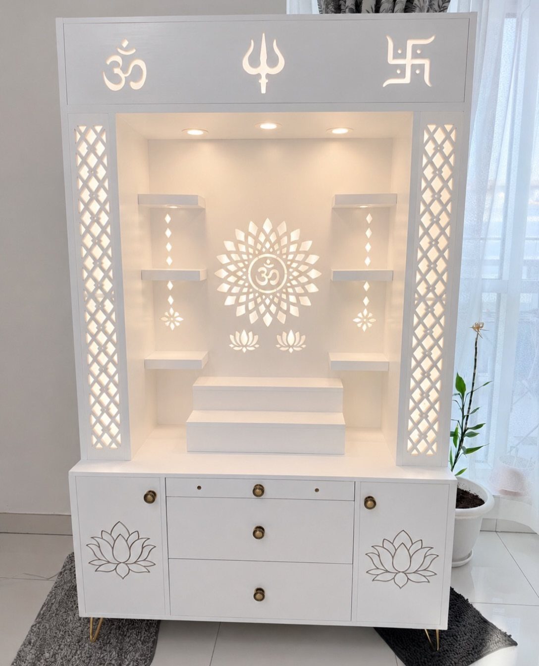34 Puja Unit Design Modern Ideas for Your Home in 2026 30 White modern pooja unit featuring a backlit Om symbol and intricate jaali side panels.