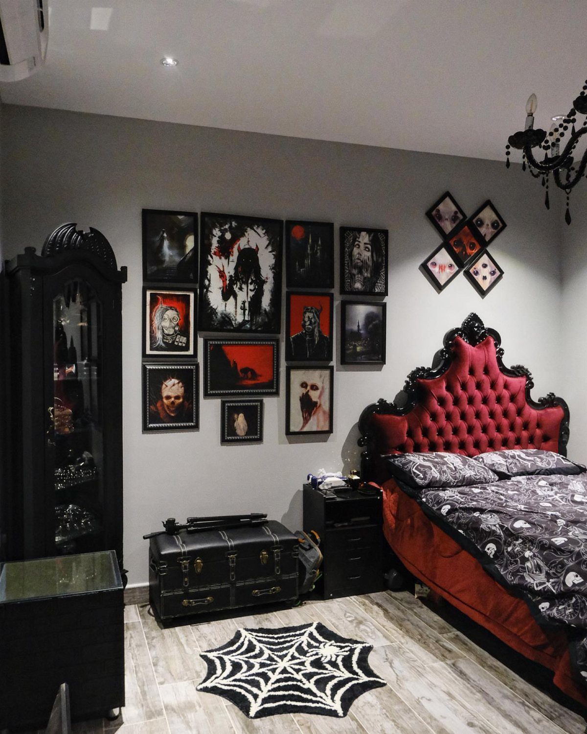 13 Alt Room Decor Ideas with Moody Colors, Wood, and Plants 11 Gothic bedroom with red tufted headboard and red, black, and white wall art.