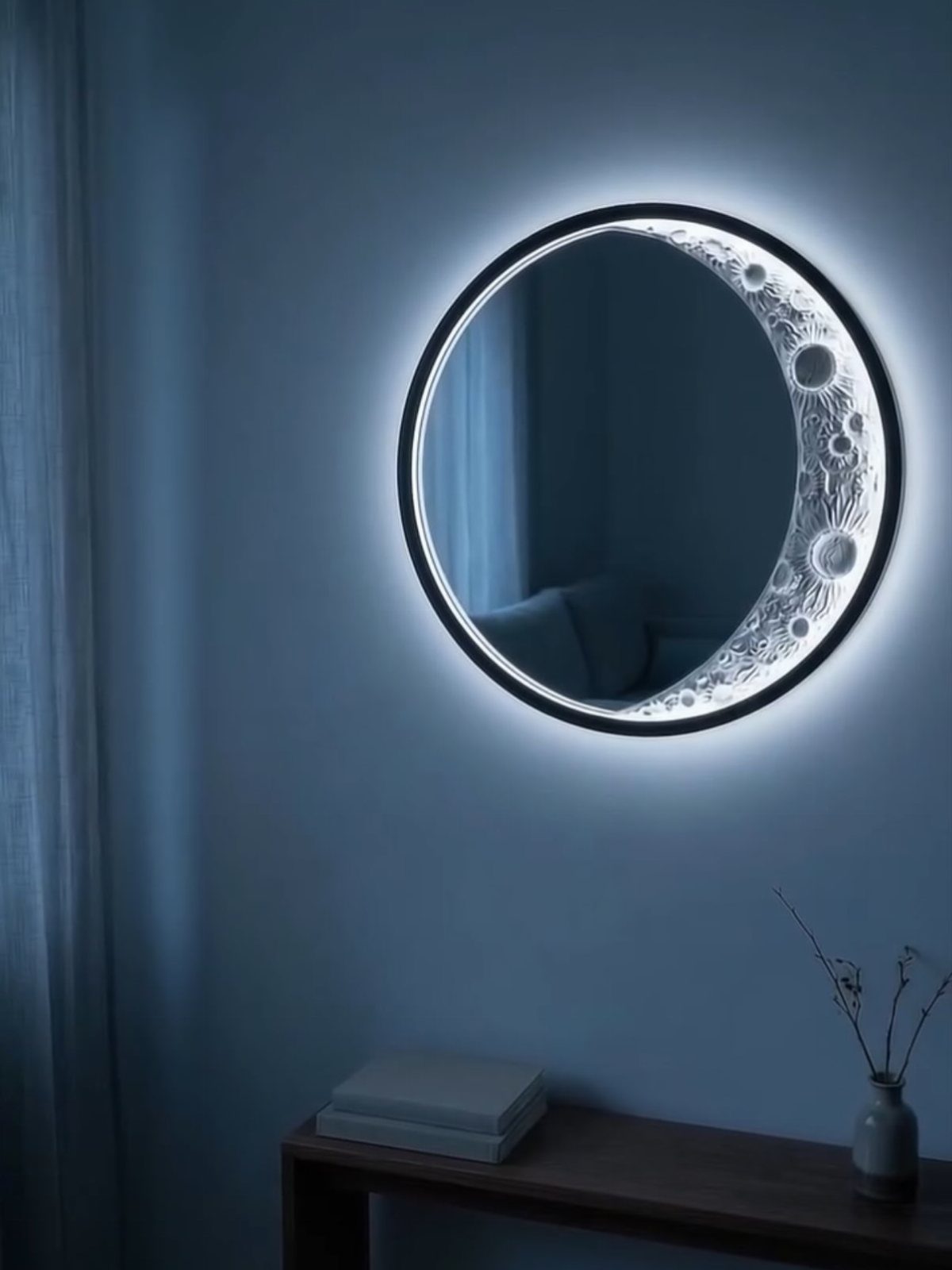 Mirror Wall Art: 25 Ideas from Sunburst to Floor Mirrors 6 Round backlit wall mirror with a crescent moon design on a blue wall.