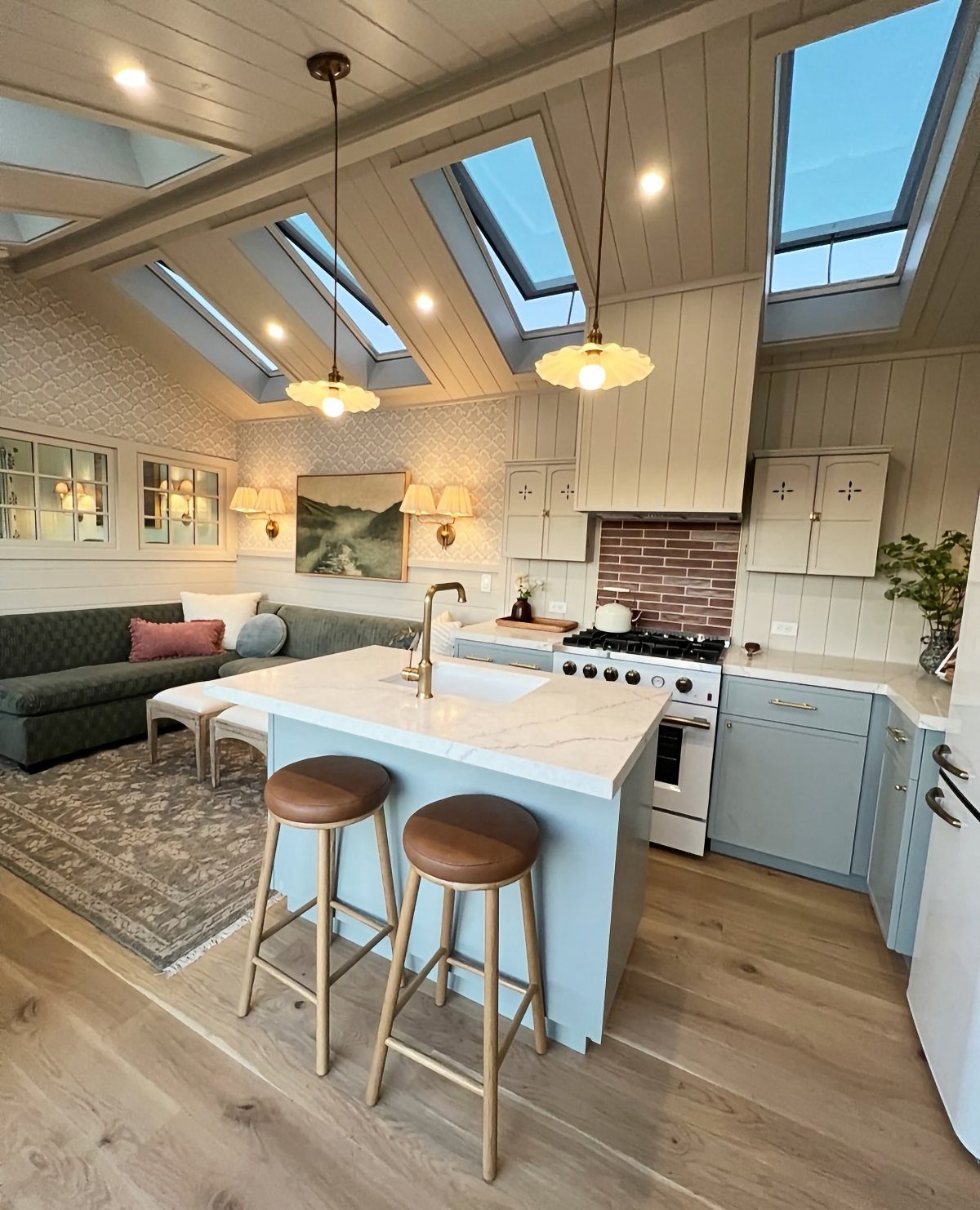 Tiny House Layout Ideas: 34 Kitchens, Lofts, Decks, Porches 8 Tiny house interior with multiple skylights in the ceiling illuminating a modern kitchen.