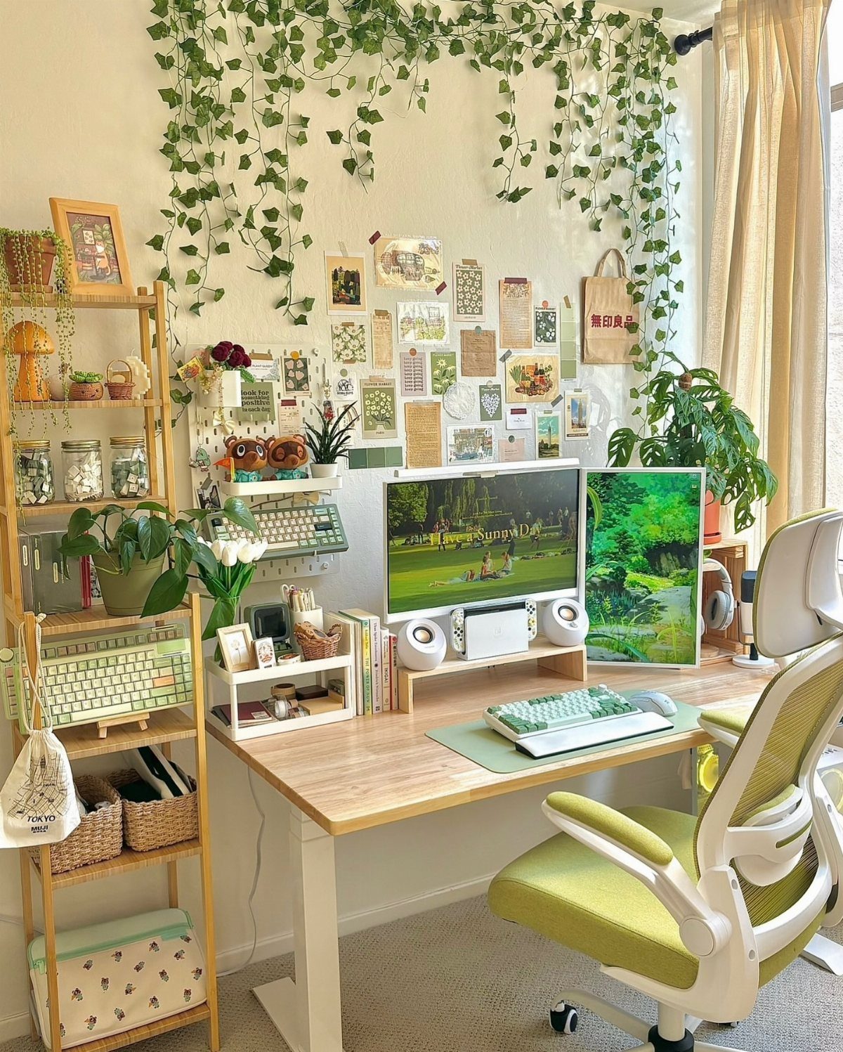 Cozy desk setup featuring small potted plants and hanging green vines on the wall.
