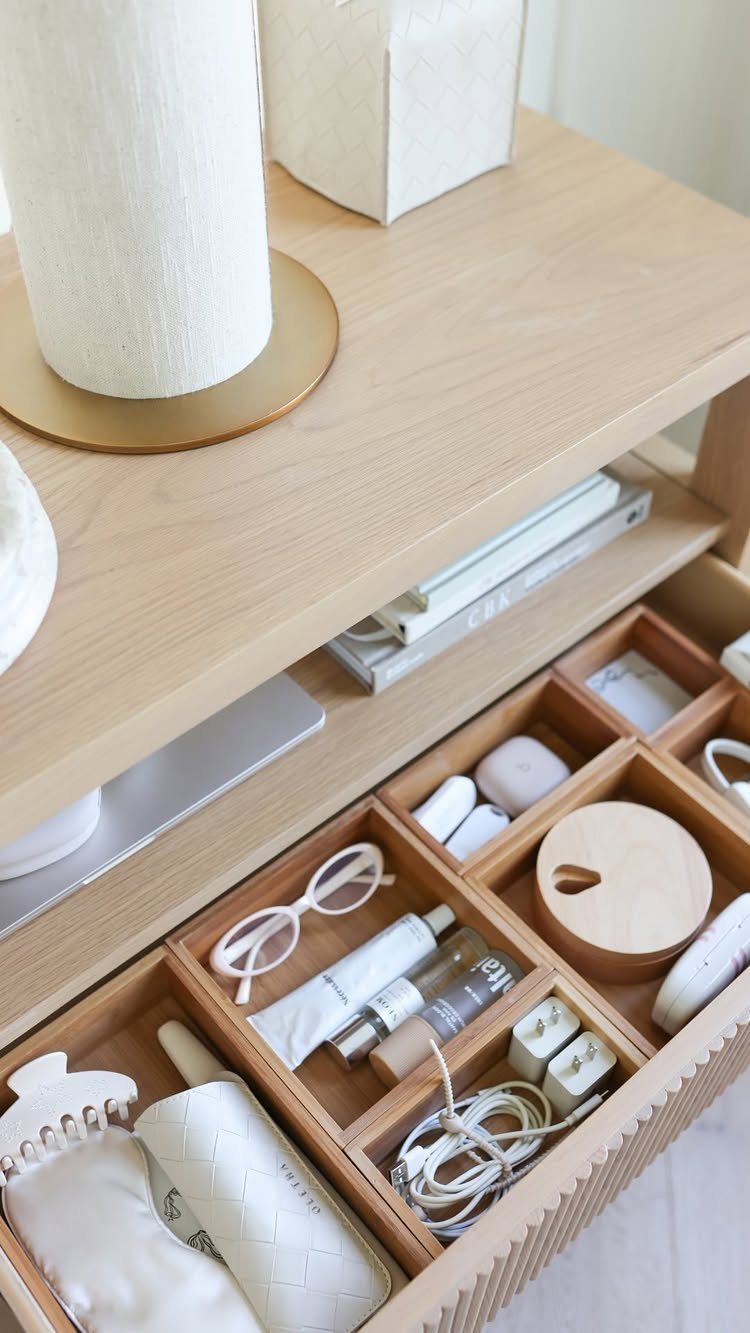 12 Ideas for Book Storage From Floating Shelves to Side Tables 12 Light wood side table with books stored in a slot and organized drawer.