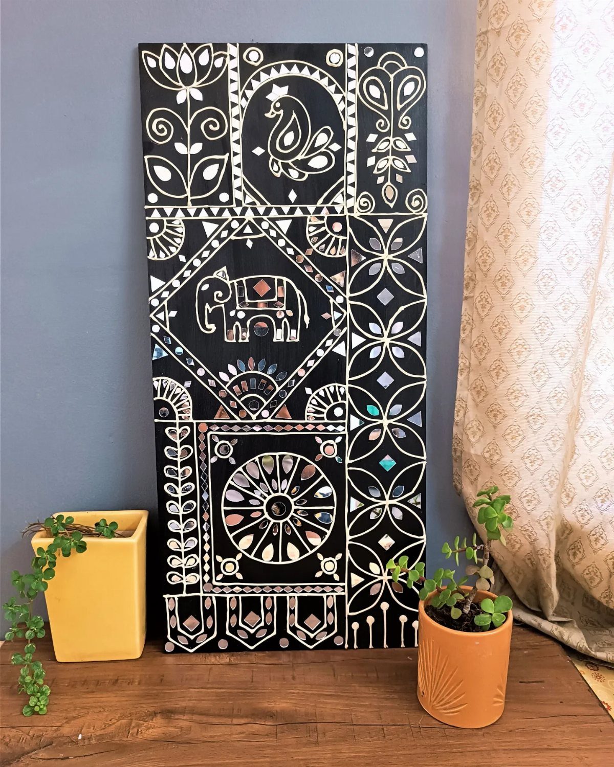 Mirror Wall Art: 25 Ideas from Sunburst to Floor Mirrors 14 Rectangular black wall art with intricate mirror mosaic patterns of an elephant and peacock.