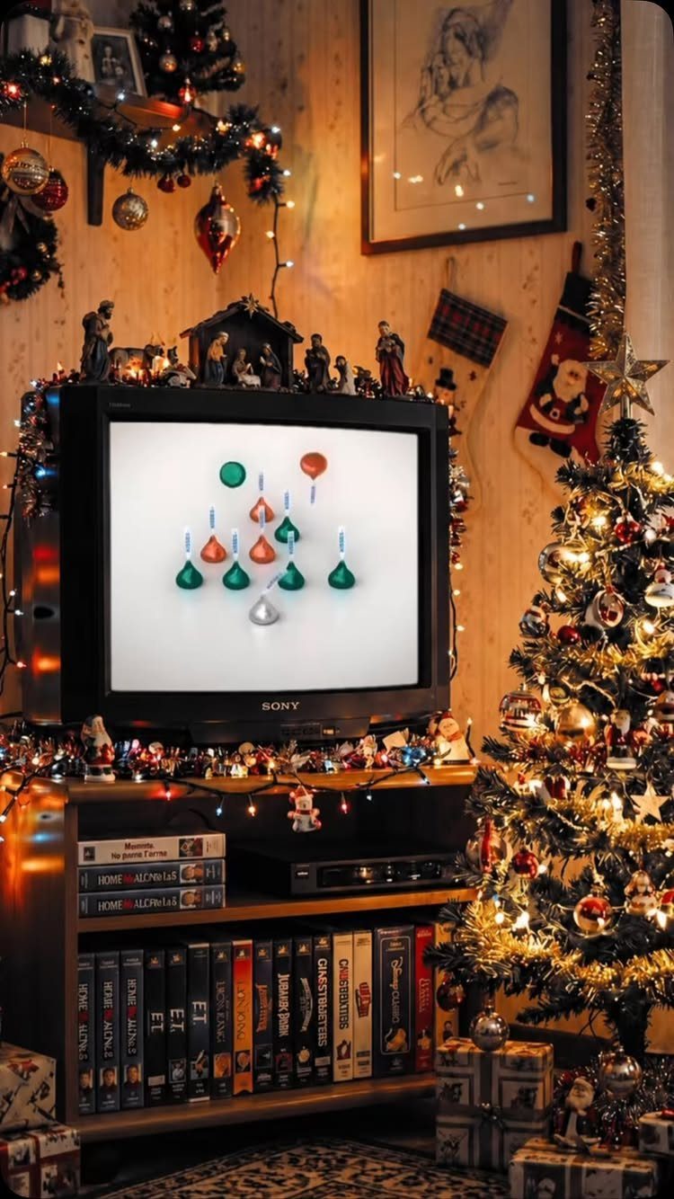 2026 Christmas Theme Ideas: 12 Looks, Heritage to Woodland 11 Christmas tree and festive decorations next to a vintage television in a cozy room