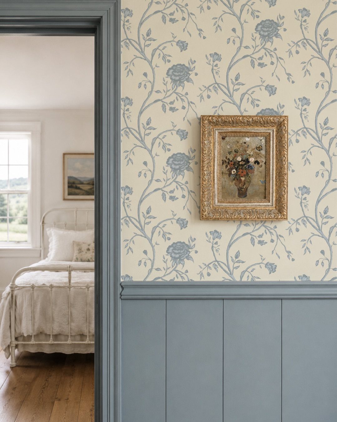 22 Bedroom Empty Wall Ideas, from Gallery Walls to Plaster 9 Floral blue and cream wallpaper with a gold framed painting and blue wainscoting.