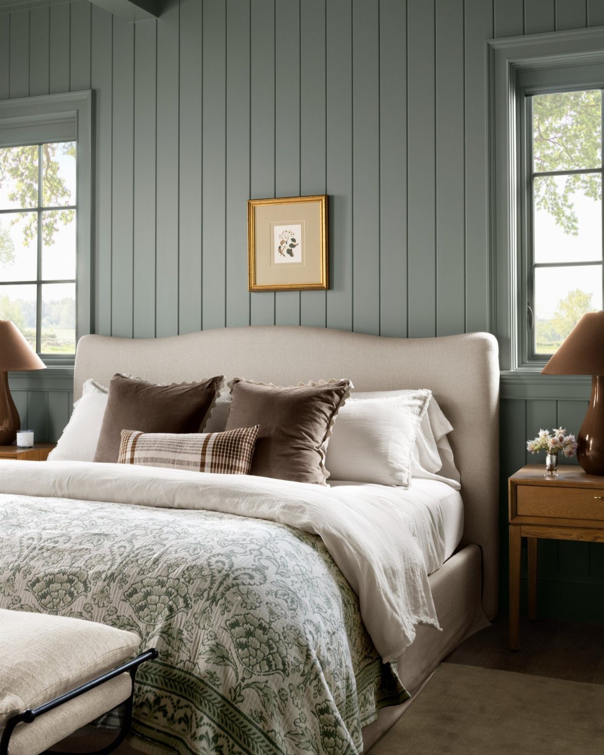 22 Bedroom Empty Wall Ideas, from Gallery Walls to Plaster 10 Bed with neutral linens against a sage green vertical wood-paneled bedroom wall.