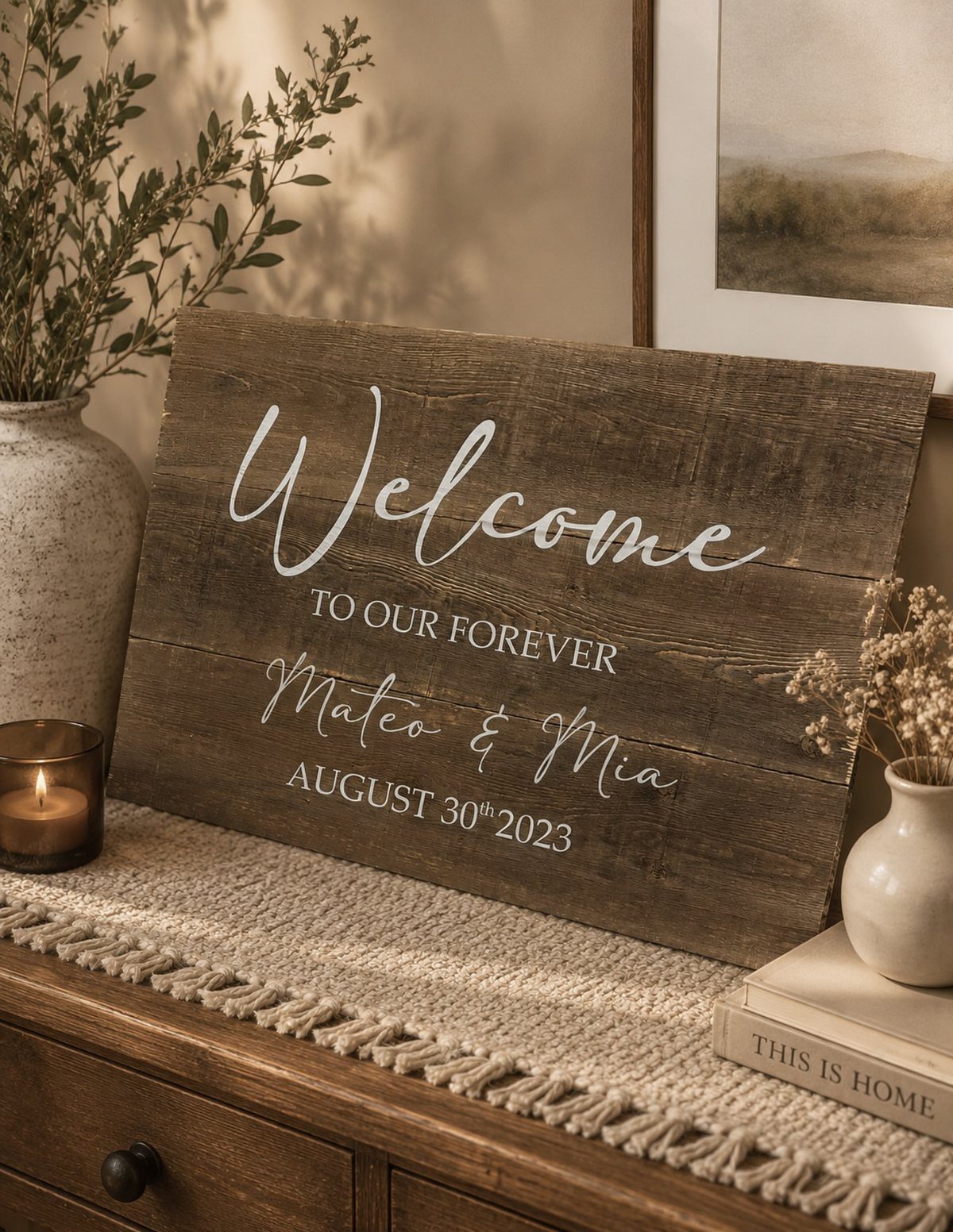 Wooden welcome sign for Mateo and Mia's wedding on a rustic dresser.