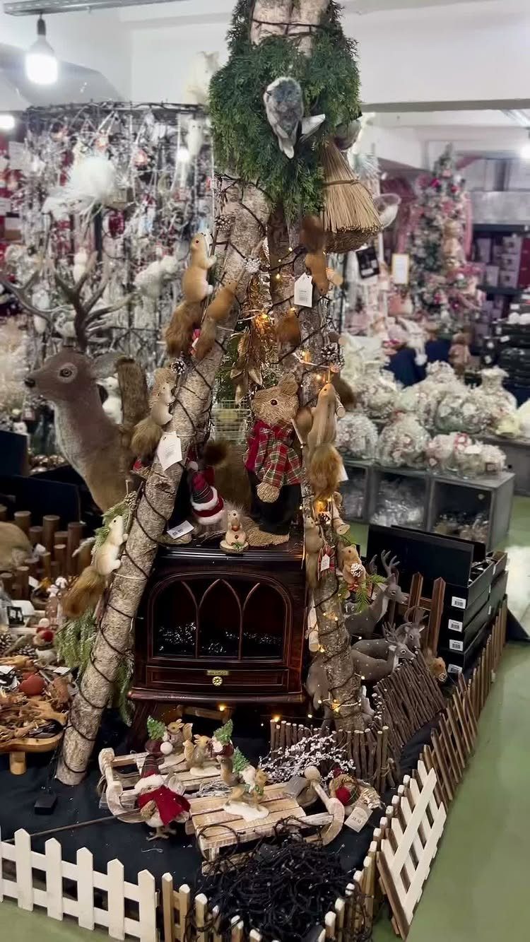 2026 Christmas Theme Ideas: 12 Looks, Heritage to Woodland 12 Rustic Christmas display with animal figurines, fairy lights, and a miniature sleigh.