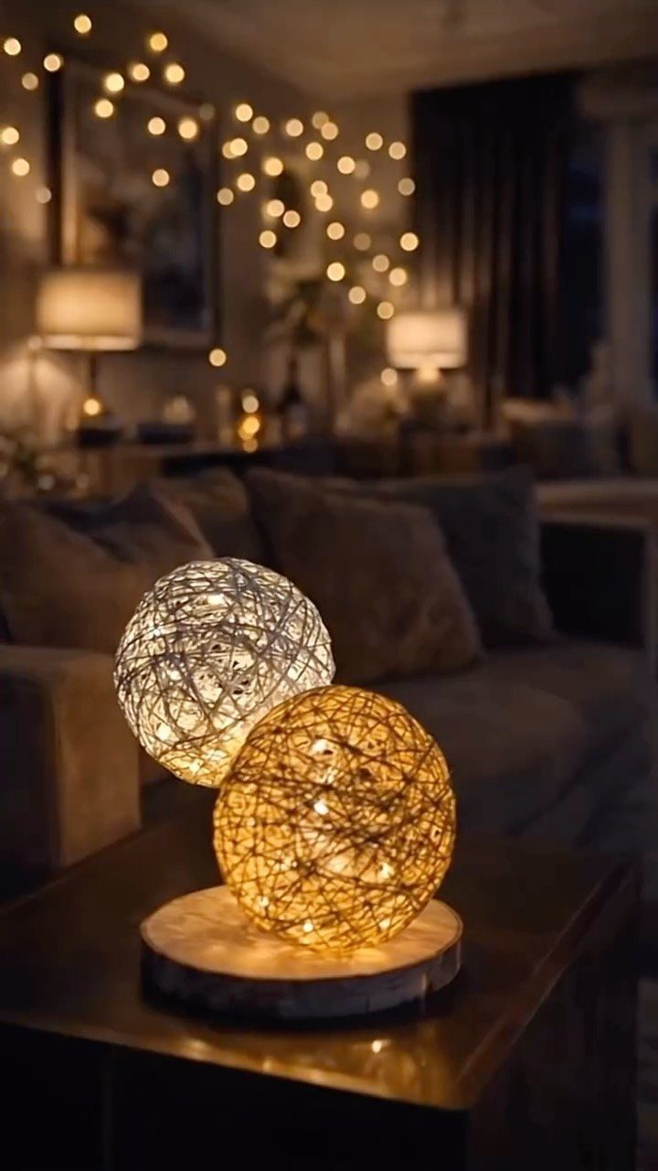 Make Table Lamp Ideas: 14 Designs in Wood, Glass and Ceramic 8 Two spherical woven string lamps on a wooden base in a cozy room.